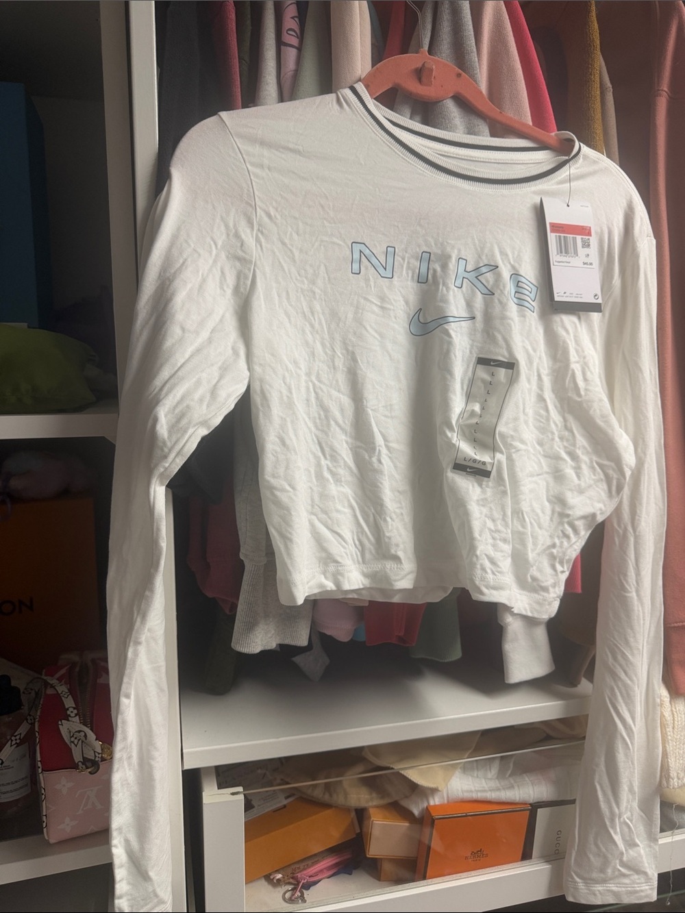 Nike White Cropped Long Sleeve Tee with Light Blue Logo